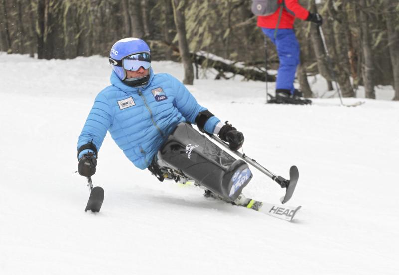 <p>People enjoying adaptive ski in the mountains.</p>
