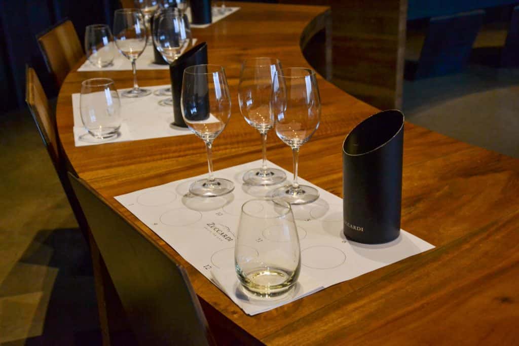 Table set for a tasting at Zuccardi, with wine glasses and water glasses.