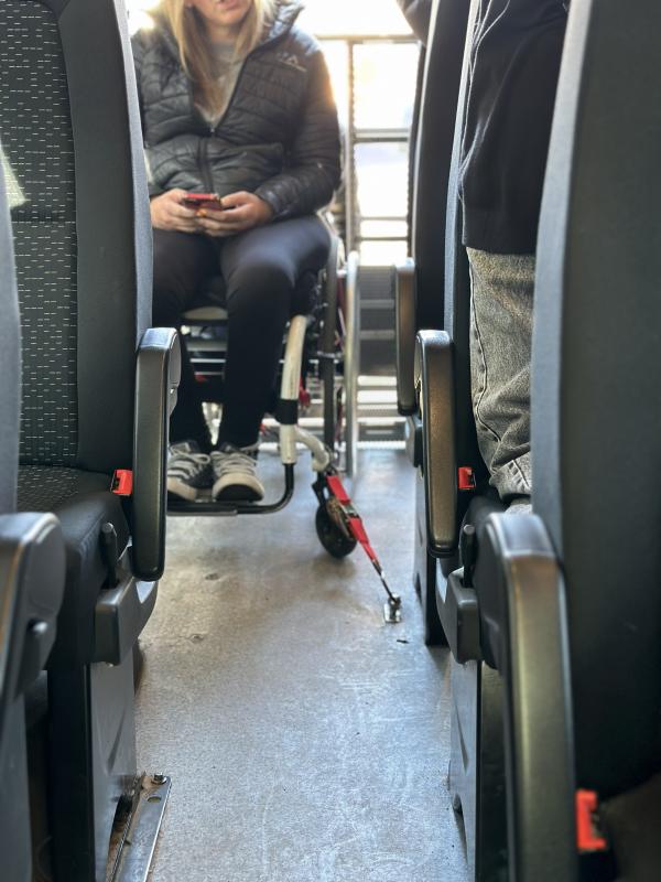 Wheelchair secured inside an adapted vehicle in Mendoza.